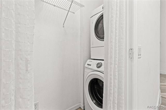 laundry room featuring stacked washing maching and dryer