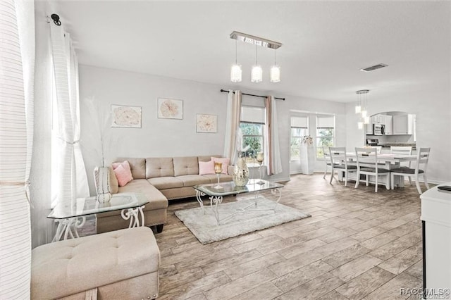 living room with light hardwood / wood-style flooring