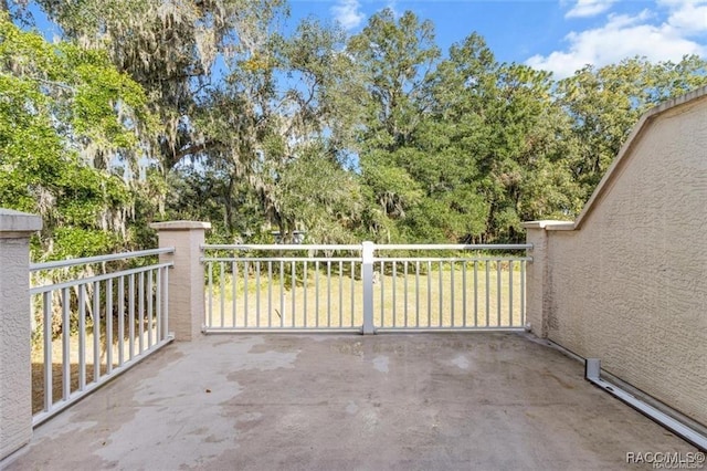 view of patio featuring a balcony