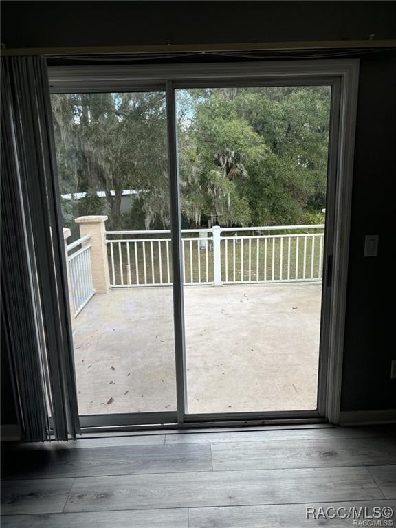 doorway to outside with hardwood / wood-style floors