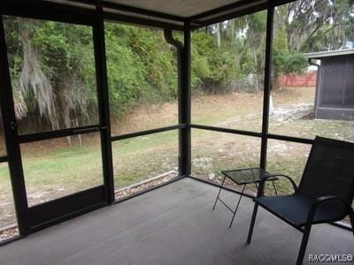 unfurnished sunroom with a healthy amount of sunlight