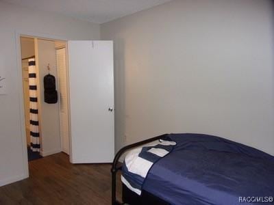 bedroom featuring dark hardwood / wood-style flooring