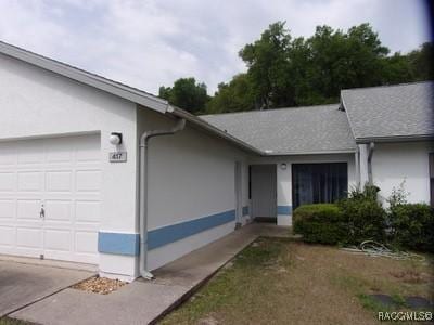 single story home with a garage