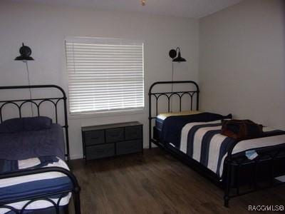 bedroom featuring dark hardwood / wood-style floors