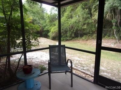 unfurnished sunroom with plenty of natural light