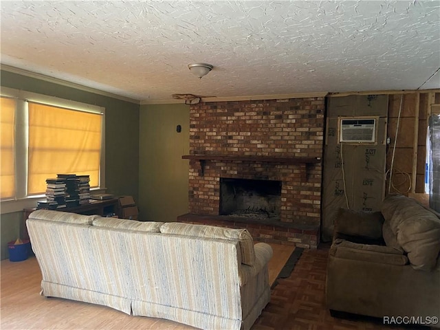 living area featuring a brick fireplace, parquet floors, a textured ceiling, and a wall mounted AC