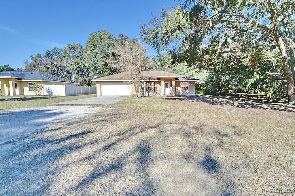 view of front of property with a garage