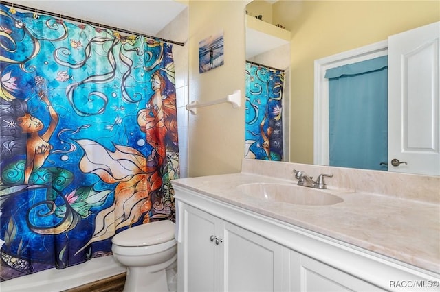 bathroom featuring hardwood / wood-style floors, vanity, and toilet