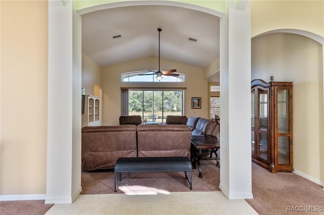 living room with ceiling fan, lofted ceiling, and light carpet