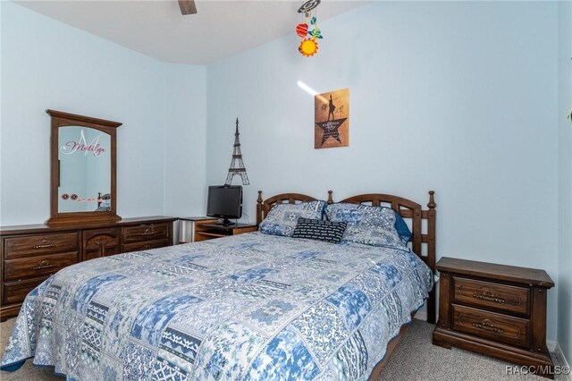 bedroom featuring light colored carpet and ceiling fan