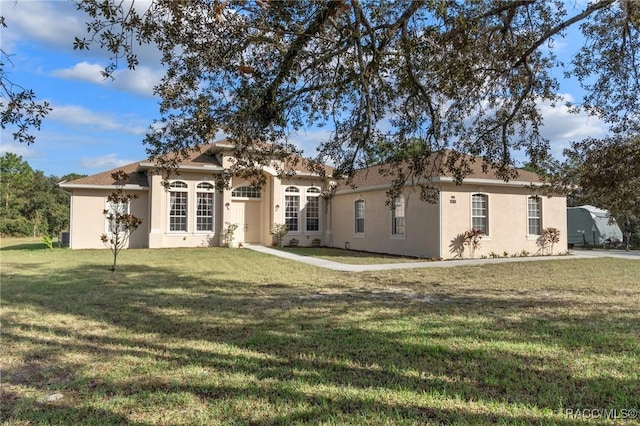 view of front of home with a front lawn