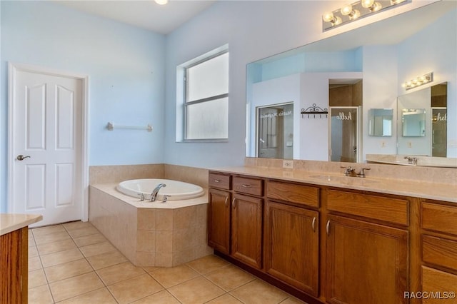 bathroom with vanity, tile patterned floors, and independent shower and bath