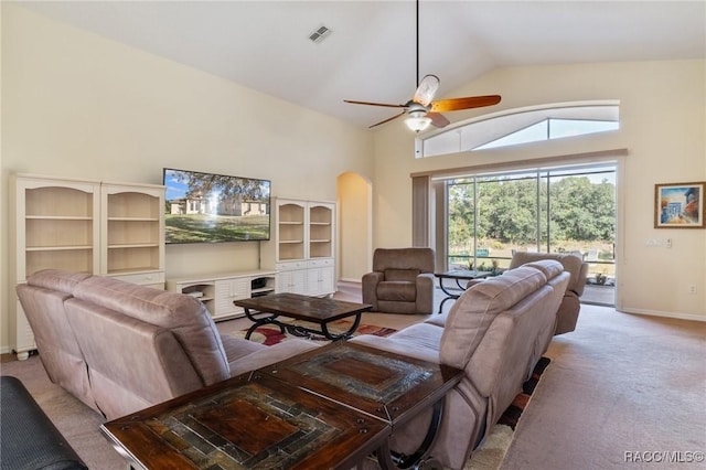 carpeted living room featuring ceiling fan and lofted ceiling