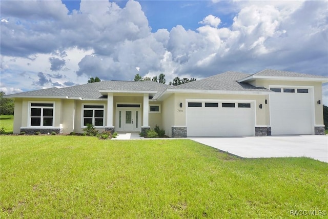 786 E Dunbar Ln, Hernando, FL 34442 - prairie-style house with a garage, concrete driveway, a front yard, and stone siding