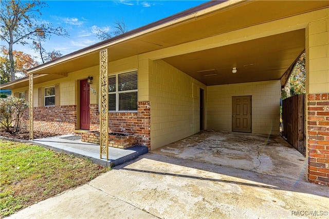 property entrance with a carport