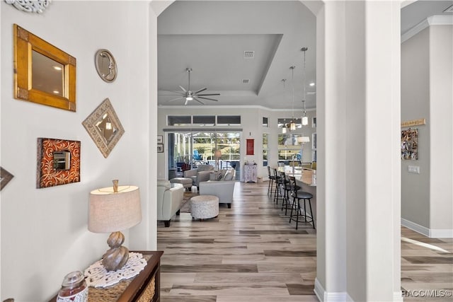 hall featuring hardwood / wood-style floors and ornamental molding