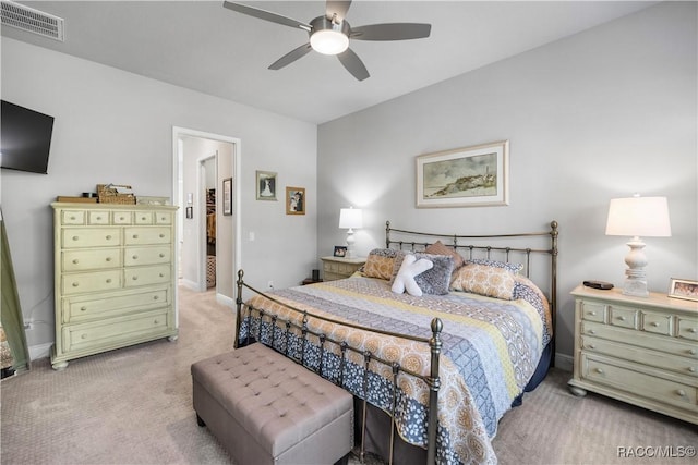 bedroom featuring ceiling fan and light carpet