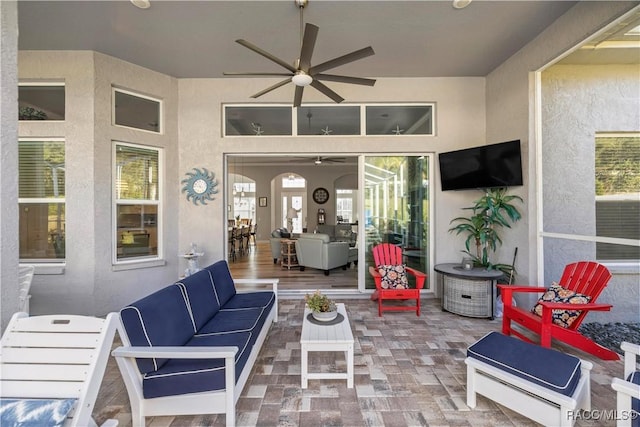 view of patio with outdoor lounge area and ceiling fan