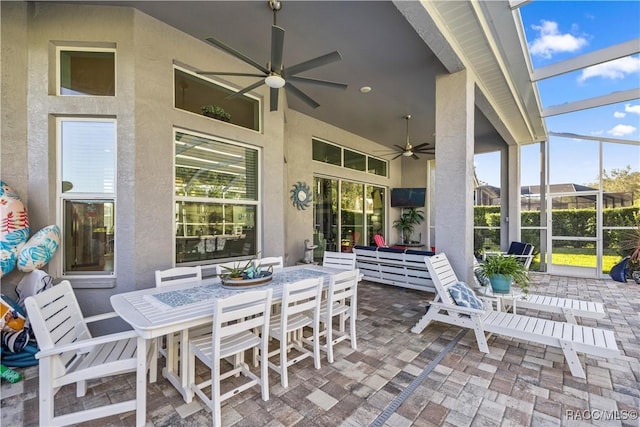 view of patio / terrace with glass enclosure and ceiling fan