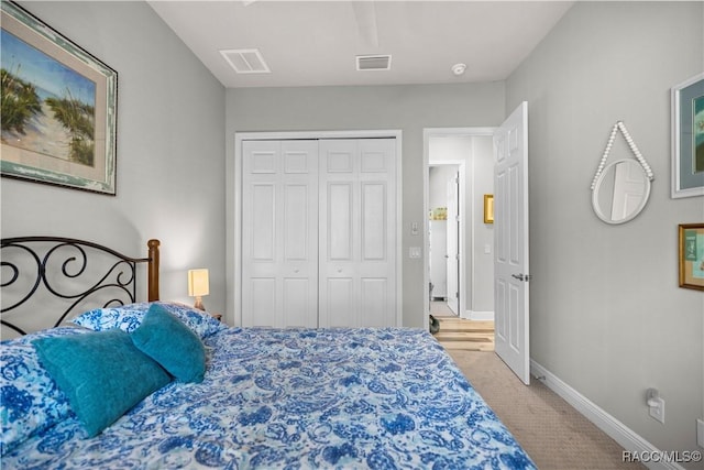 carpeted bedroom with a closet