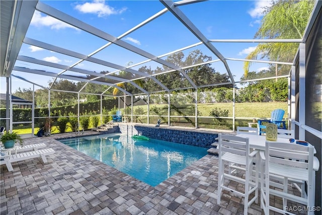 view of pool featuring a lanai and a patio area