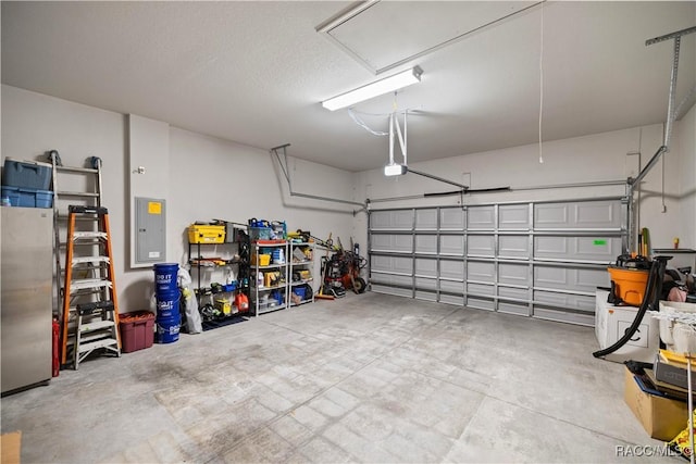 garage featuring electric panel and a garage door opener