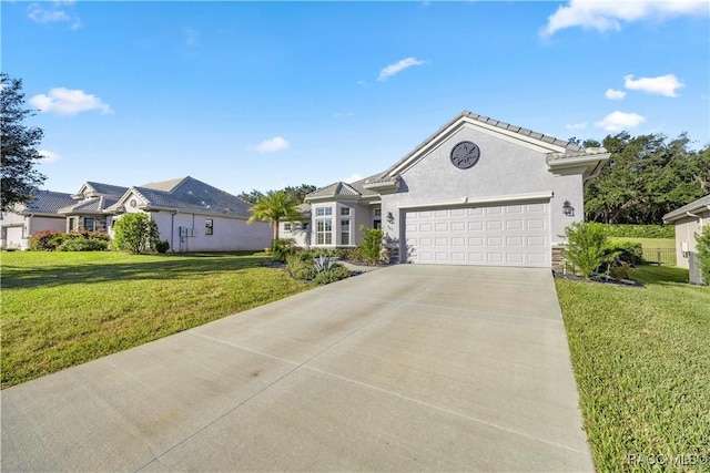 single story home with a garage and a front lawn