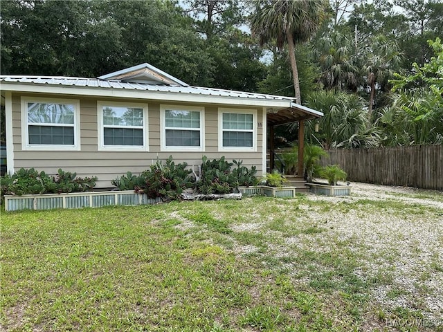 18 56th St, Yankeetown, FL 34498 - view of front of house featuring a metal roof