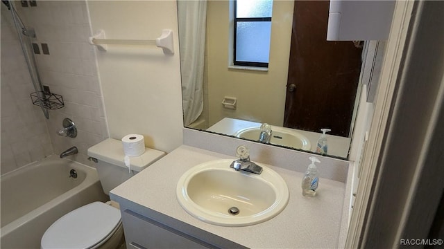 full bath featuring toilet, tub / shower combination, and vanity