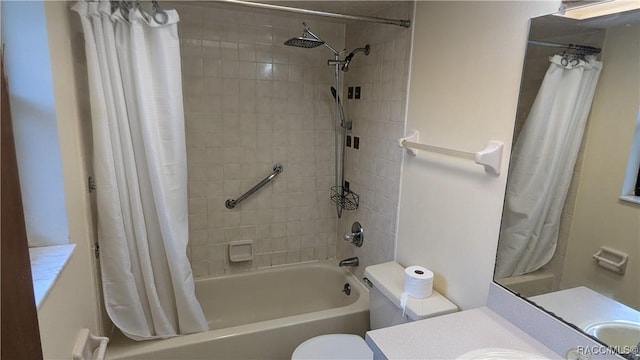 full bathroom featuring shower / tub combo, vanity, and toilet