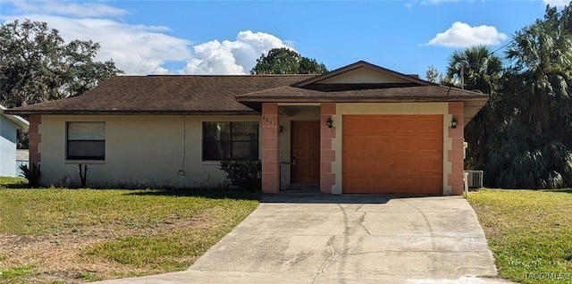 single story home with a garage, central AC, and a front lawn