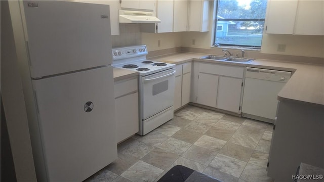 kitchen featuring under cabinet range hood, white appliances, a sink, white cabinets, and light countertops