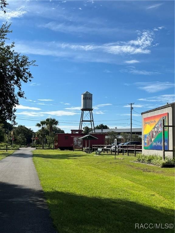 surrounding community featuring a yard