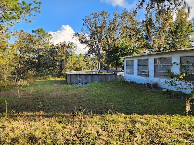 view of yard with central AC unit