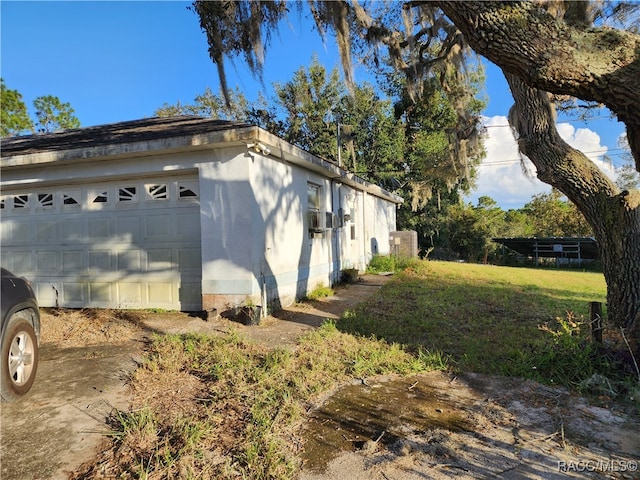 view of property exterior featuring a garage