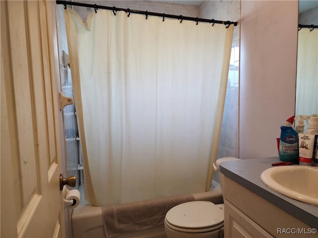 full bathroom with vanity, toilet, and shower / bathtub combination with curtain