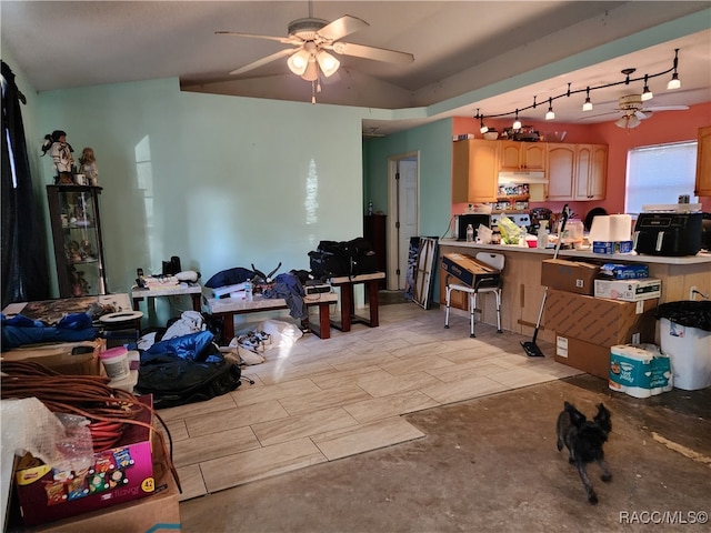 interior space with ceiling fan