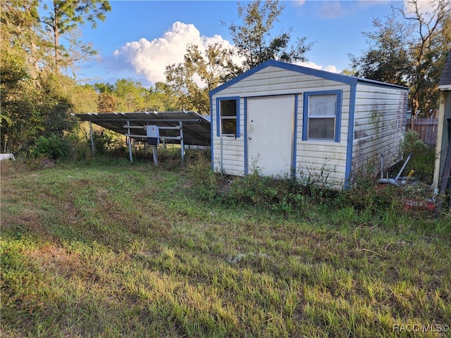 view of outbuilding featuring a carport