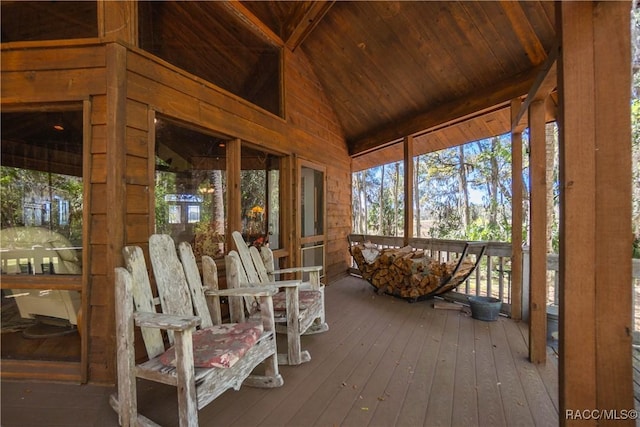 sunroom / solarium with vaulted ceiling with beams and wooden ceiling