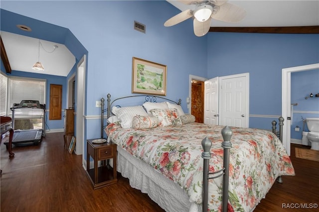 bedroom featuring lofted ceiling, wood finished floors, and visible vents