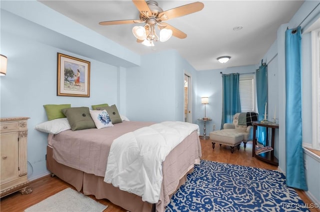 bedroom with ceiling fan and wood finished floors