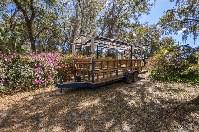 wooden deck with an outdoor structure