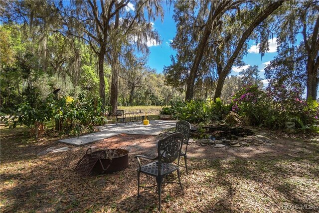 view of patio with a forest view