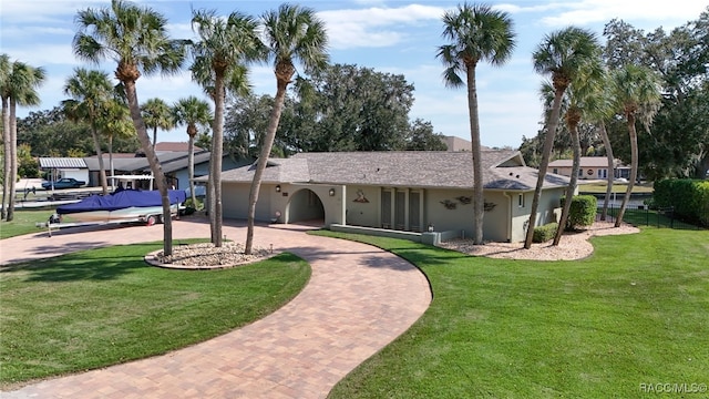 ranch-style house with a front yard