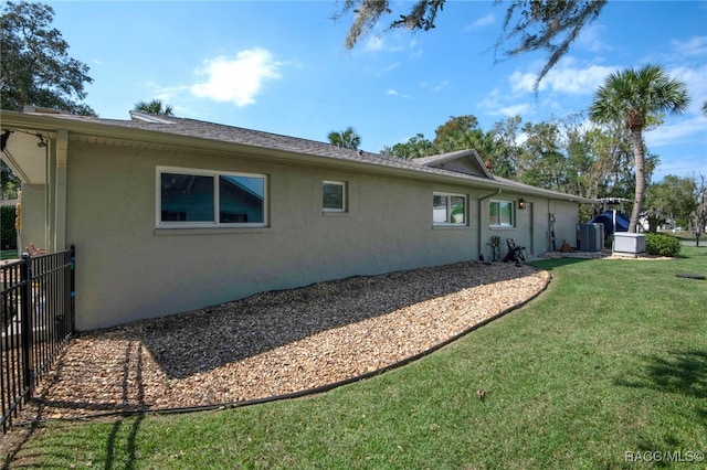 rear view of house featuring a lawn