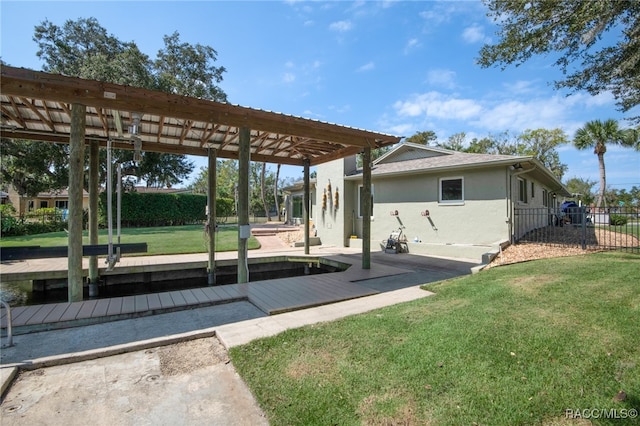 rear view of house with a lawn and a pergola