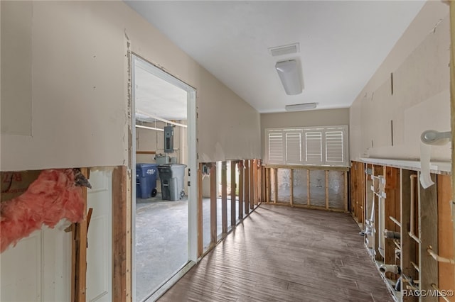 hall with dark wood-type flooring and electric panel