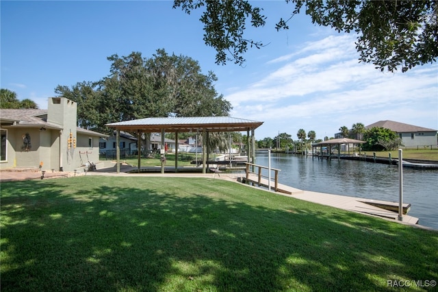 dock area featuring a yard and a water view