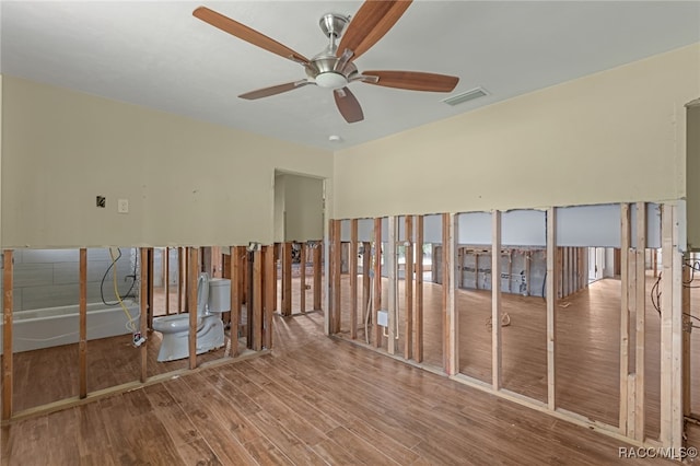 spare room featuring ceiling fan and wood-type flooring