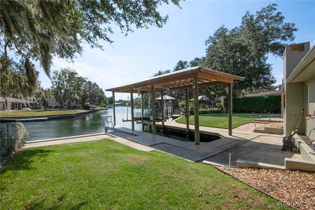 view of dock with a water view and a yard